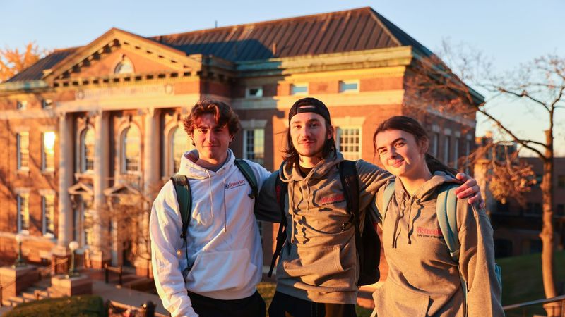 Three Lally students outside on campus